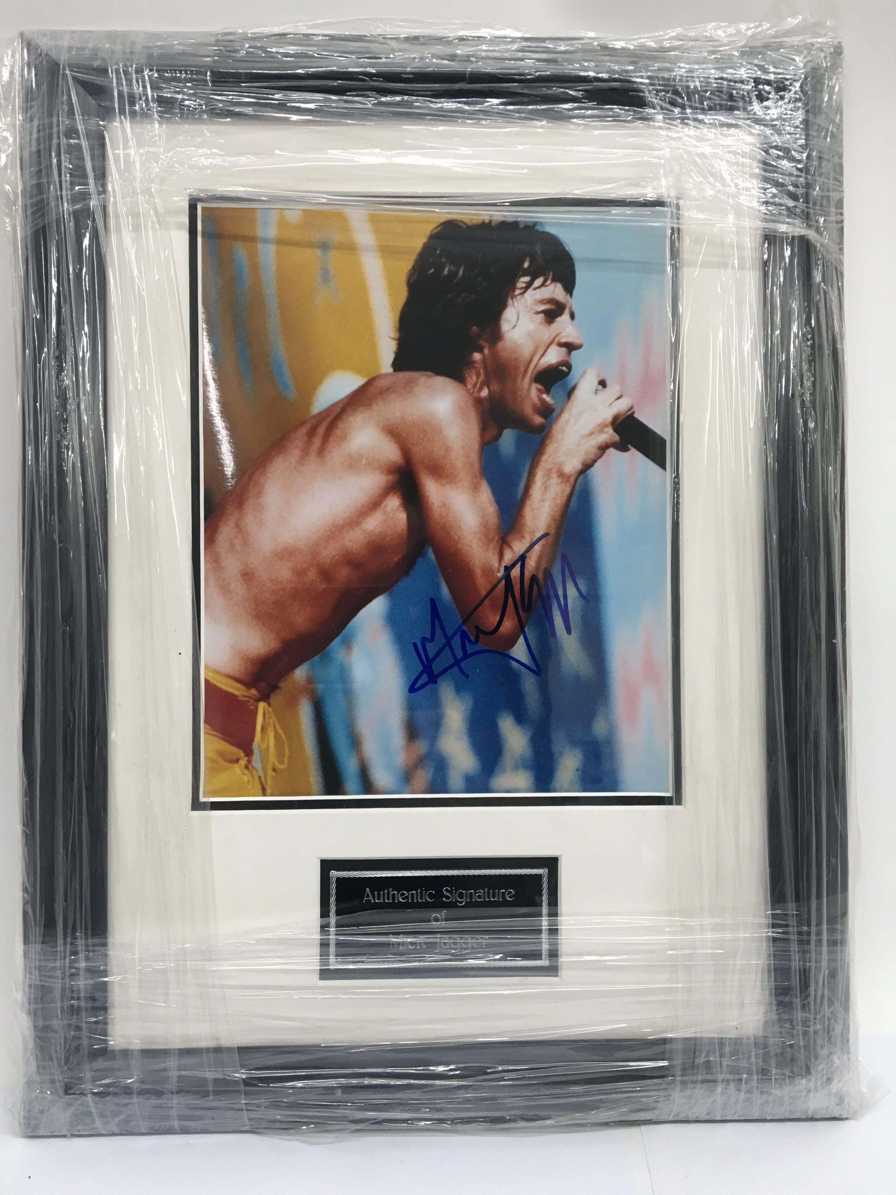 A signed and framed photograph of Mick Jagger.