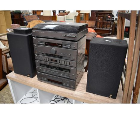 A stackable hi fi unit and record player by JVC with a pair of speakers