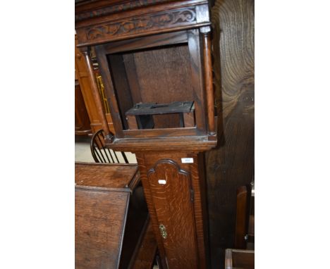 A small oak longcase clock case and movement (stamped Surtwangen) (no face)