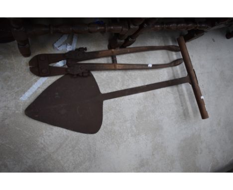 A vintage hay or silage knife and bolt croppers