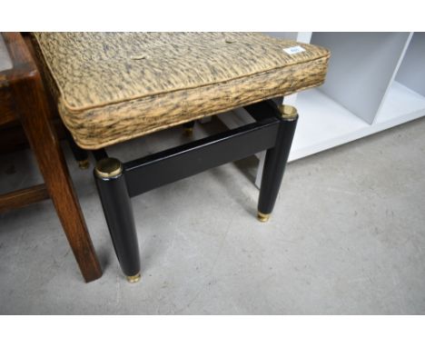 A vintage bow topped dressing table stool having vinyl seat, G Plan label