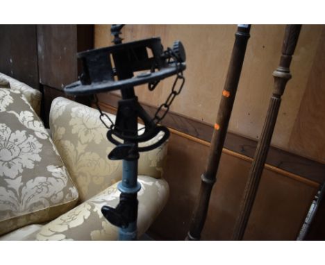 A vintage spotlight or searchlight stand