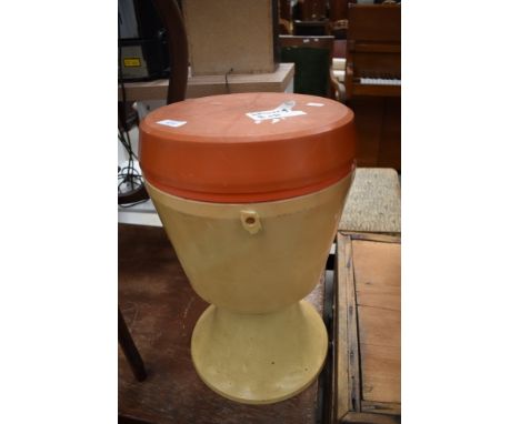 A vintage toughened plastic sewing box, similar material and design to the iconic mushroom chairs of the mid century period