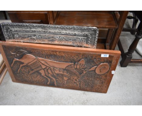 A vintage copper work plaque 'Roland blew his horn' and a metal work mirror