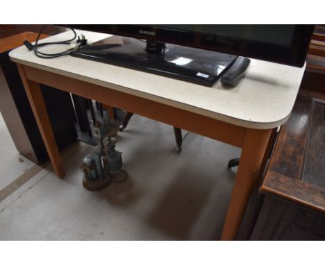 A vintage formica topped kitchen work table having rounded edges, approx 114 x 61cm, height 76cm