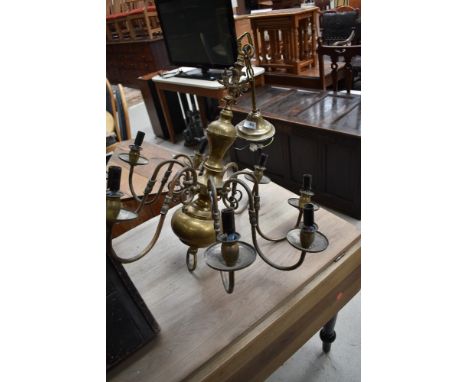 A vintage brass electric ceiling light, eight branch
