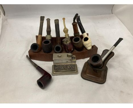 EIGHT VINTAGE PIPES WITH STANDS AND A TABLE LIGHTER 