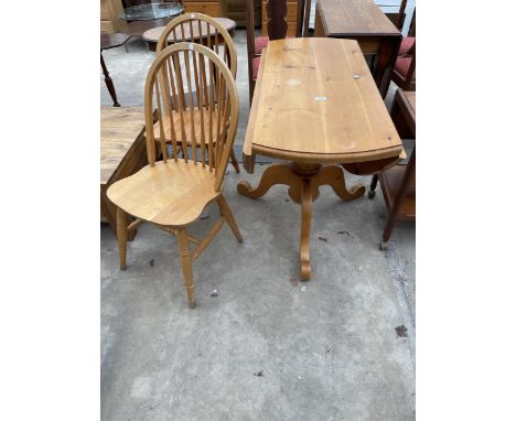 A PINE 42" DIAMETER DROP-LEAF DINING TABLE ON TRIPOD BASE AND A PAIR OF WINDSOR STYLE CHAIRS 