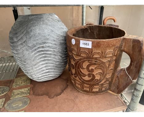 A LARGE DECORATIVE WOODEN CARVED CUP AND A CONCRETE PLANTER 