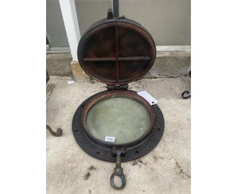 A VINTAGE AND DECORATIVE CAST IRON PORTHOLE 