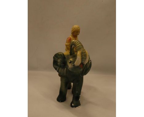 A VINTAGE CHALK FIGURE OF A BOY ON AN ELEPHANT, HEIGHT 30CM, LENGTH APPROX 24CM 