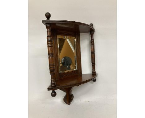 A MAHOGANY EDWARDIAN CORNER MIRROR WITH TWO COLUMS AND SHELF APPROX 18' TALL 