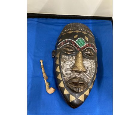 AN AFRICAN TRIBAL MASK, 29CM X 15CM PLUS A VINTAGE HANDMADE TRIBAL WOODEN PIPE 