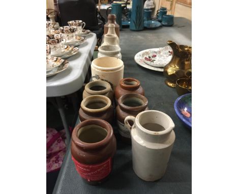 A GROUP OF VINTAGE STONEWARE JARS AND BOTTLES, SOME WITH NEWER LABELS 