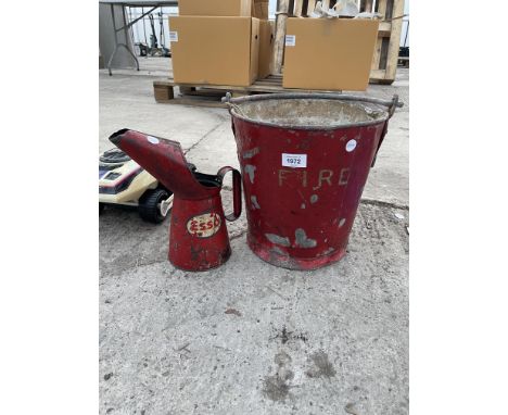 A VINTAGE FIRE BUCKET AND A VINTAGE ESSO OIL JUG 