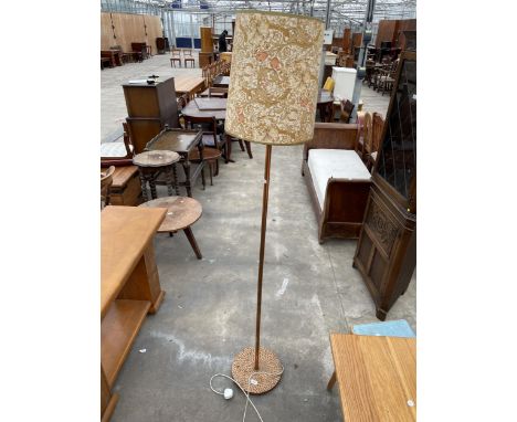 A STANDARD LAMP WITH COPPER BASE AND POLE COMPLETE WITH SHADE 