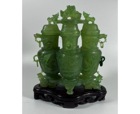 A JADE STYLE HARDSTONE QUADRUPLE LIDDED VASE ON WOODEN VASE, HEIGHT 20 CM 