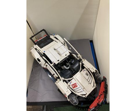 A BUILT MODEL OF A PORSCHE CAR 