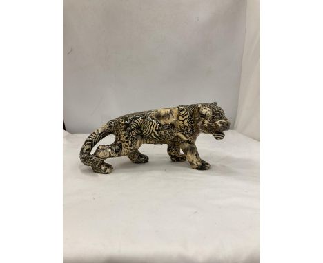 A MODEL OF A LARGE CAT WITH A PATCHWORK SAFARI DESIGN, HEIGHT 15CM, LENGTH 30CM 