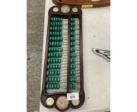 A CHINESE ABACUS WITH MALACHITE COUNTERS AND SILVER COINS 