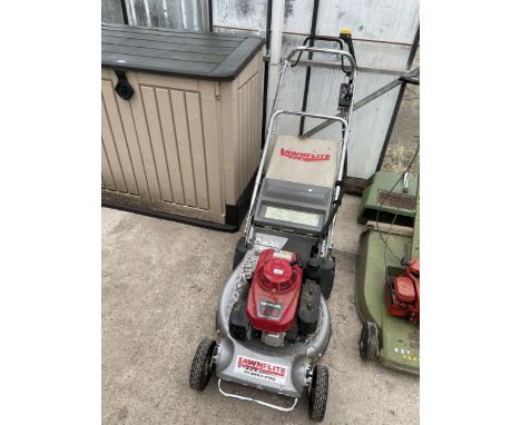 A LAWNFLITE PRO 553 ROTARY MOWER WITH HONDA ENGINE AND GRASS BOX 
