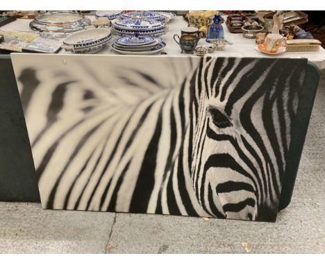 A LARGE PRINT ON CANVAS OF A ZEBRA, 118CM X 79CM 