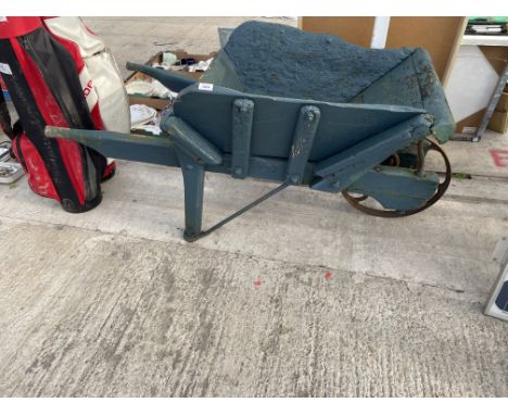 A LARGE HEAVY WOODEN GARDEN WHEEL BARROW PLANTER 
