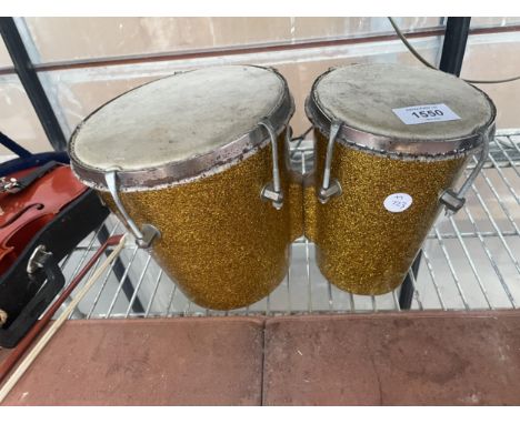 A SMALL FIBRE GLAS BONGO DRUM 