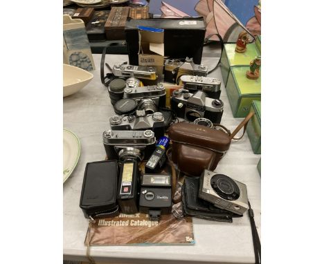 A LARGE COLLECTION OF VINTAGE CAMERAS, CASES, LENS AND FLASHES TO INCLUDE PRATIKA, HANINEX, YASHIKA ETC 