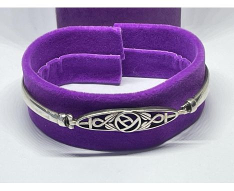 A SILVER MACINTOSH BANGLE, BOXED 