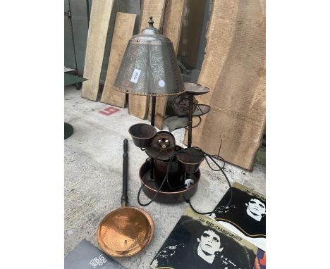 AN INDOOR LAMP WATER FEATURE AND A SMALL BED WARMING PAN 