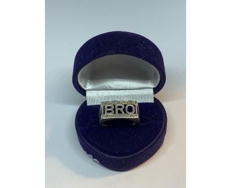 A SILVER BRO RING IN A PRESENTATION BOX 