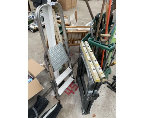 THREE ITEMS TO INCLUDE TWO BUILDERS TRESTLES AND A THREE RUNG ALUMINIUM STEP LADDER 