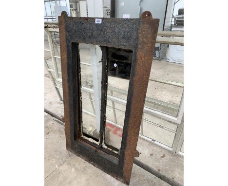 A VINTAGE CAST IRON WINDOW FRAME 