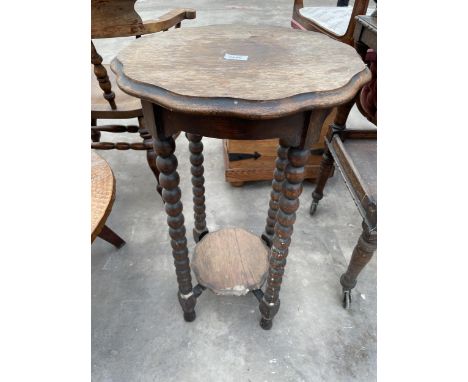AN EARLY 20TH CENTURY OAK BOBBIN TURNED TWO TIER JARDINIERE STAND, 17.5" DIAMETER 