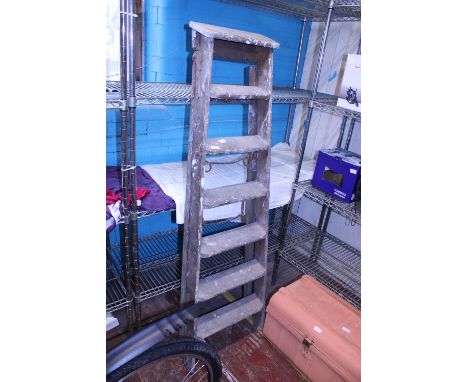 A pair of vintage wooden step ladders, shipping unavailable 