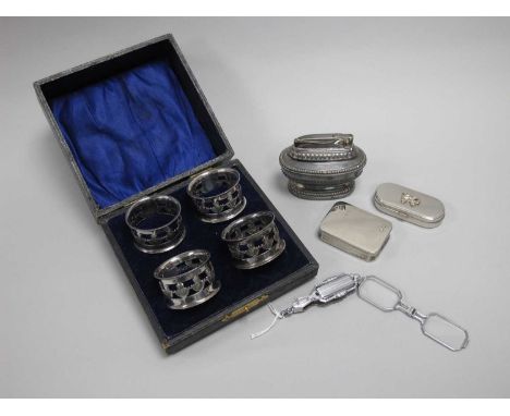 Art Deco Style Lorgnettes, together with a cased set of four thistle design plated napkin rings, modern pill boxes, Ronson ta