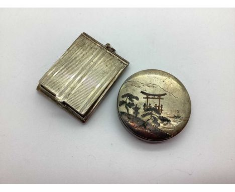 A 1920's Rectangular Powder Compact, Birmingham 1923, allover engine turned, gilt lined with bevelled internal mirror; a Japa