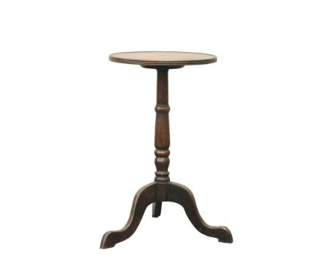 the circular top above a central turned support, raised on a tripod base