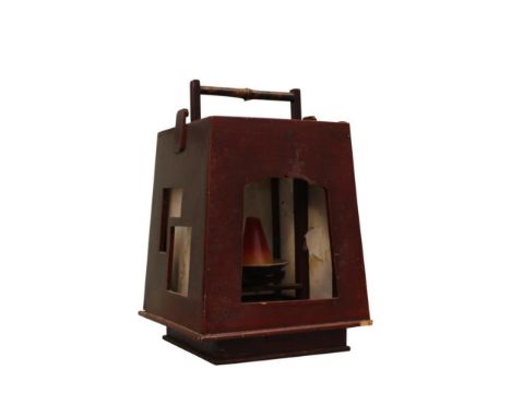 the lantern with paper panel sides held within a tapering wooden case, possibly from an internment camp