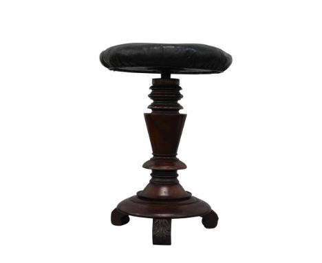 the pu leather upholstered top resting on a turned support and terminating in a tripod base with acanthus capped toes