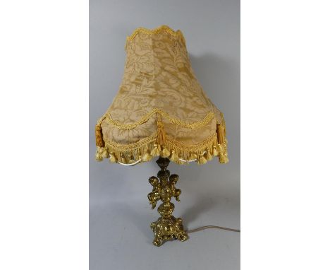 A Brass Table Lamp and Shade with Cherub Decoration to Support, 28cm High 