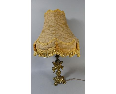 A Brass Table Lamp and Shade with Cherub Decoration to Support, 28cm High 