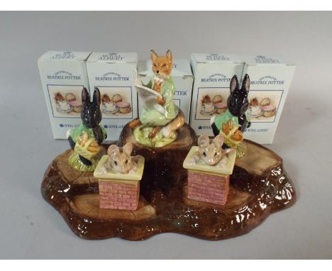 A Collection of Five Boxed Beatrix Potter Figures by Royal Albert Together with a Beswick Tree Trunk Stand 