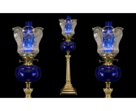Large Bristol Blue Oil Lamp on a Classical Brass Column with capitals on a square base, with a blue funnel and etched glass s