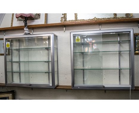 Chrome &amp; Glass Display Cabinet with three moveable glass shelves and lighting, and glass sliding doors.  Measures 37" hei