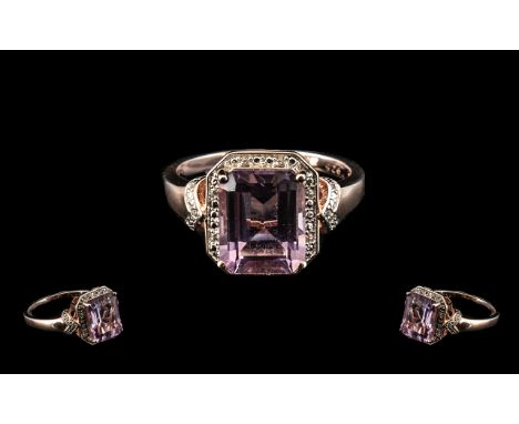 Rose de France Amethyst Halo Ring, a 3.75ct octagon cut amethyst of the Rose de France variety, framed with round cut natural