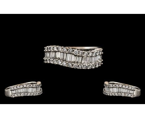 18ct White Gold - Attractive Contemporary Designed Baguette and Brilliant Cut Diamond Set Dress Ring. Marked 750 - 18ct. Colo