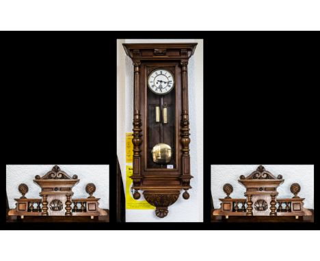 Late 19th Century Walnut Double Weighted Vienna Wall Clock, white porcelain dial, Roman numerals, raised front and sides, of 