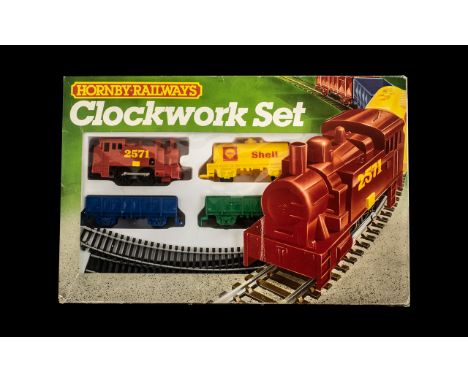 Hornby Railways Boxed Clockwork Set comprising 1/ 0-4-0 Clockwork Engine and key, 2/ Assorted Wagons, 3/ Circle of First Radi